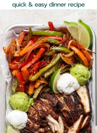 Blackstone chicken fajitas sizzling on the grill with colorful vegetables