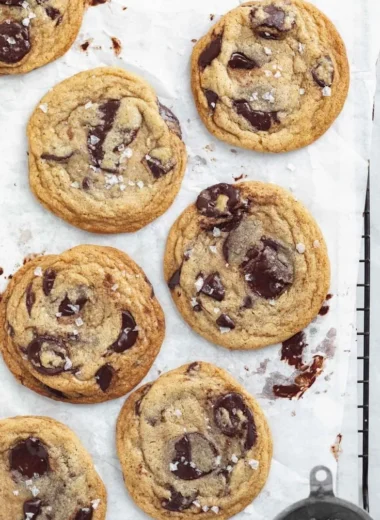 Deliciously chewy chocolate chip cookies on a wooden platter