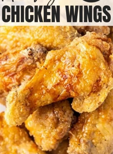 Crispy air fryer chicken wings garnished with herbs and served in a bowl
