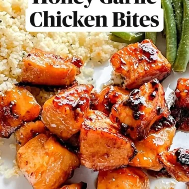 Honey Garlic Chicken Bites served on a plate with glaze and garnishes
