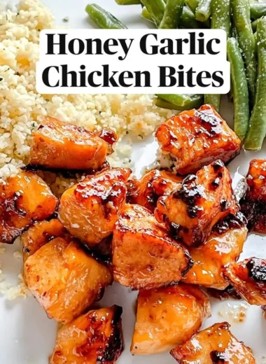 Honey Garlic Chicken Bites served on a plate with glaze and garnishes