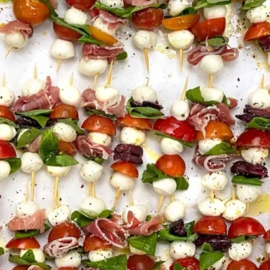 Mini Caprese Salad Skewers with cherry tomatoes, mozzarella, and basil