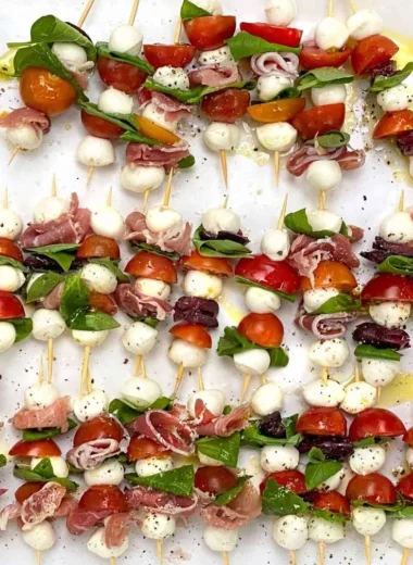 Mini Caprese Salad Skewers with cherry tomatoes, mozzarella, and basil