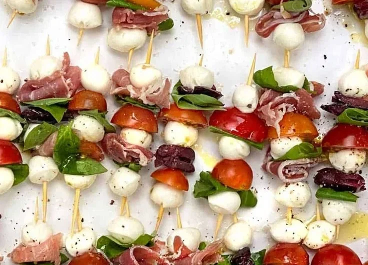 Mini Caprese Salad Skewers with cherry tomatoes, mozzarella, and basil