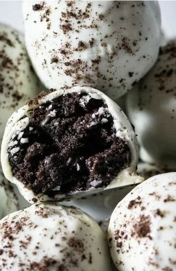 Delicious homemade Oreo Cake Balls on a decorative plate.