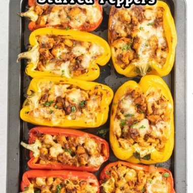 Colorful stuffed peppers filled with chicken, healthy ingredients, and seasonings.