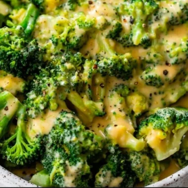 Delicious cheesy broccoli dish garnished and ready to serve