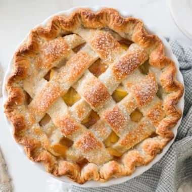 Homemade apple pie with fresh apples and golden flaky crust