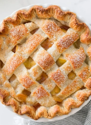 Homemade apple pie with fresh apples and golden flaky crust