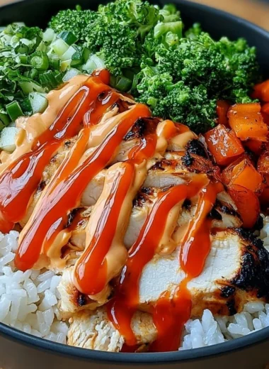 A delicious Bang Bang Chicken Bowl featuring vibrant ingredients and rich flavors.