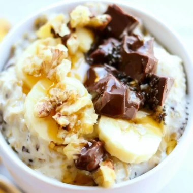 Chunky Monkey Overnight Oats with banana and chocolate in a bowl