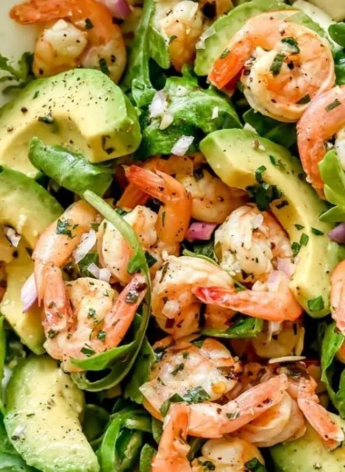 Citrus Shrimp and Avocado Salad beautifully arranged on a plate