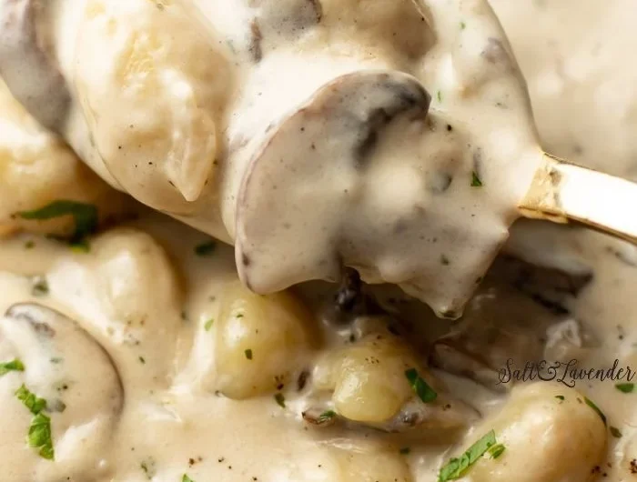 Boursin gnocchi topped with fresh herbs and cheese