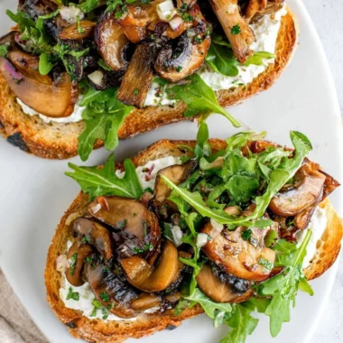 Delicious creamy mushroom toast topped with fresh herbs for an irresistible flavor.
