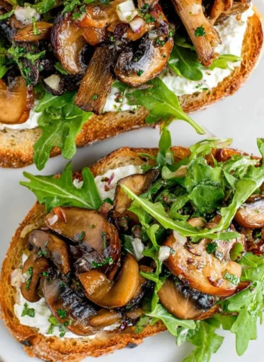 Delicious creamy mushroom toast topped with fresh herbs for an irresistible flavor.