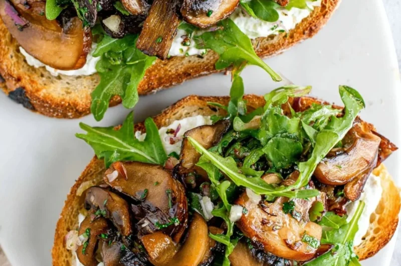 Delicious creamy mushroom toast topped with fresh herbs for an irresistible flavor.