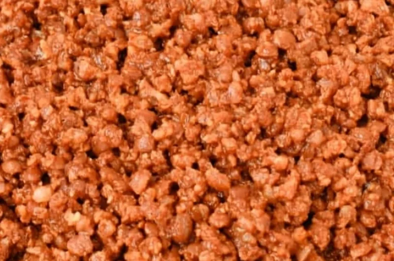 Bowl of easy lentil taco meat served with taco shells and fresh toppings.