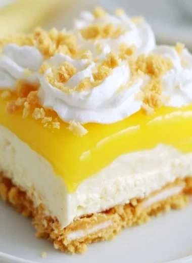 Heavenly Lemon Oreo Dessert topped with whipped cream and lemon zest