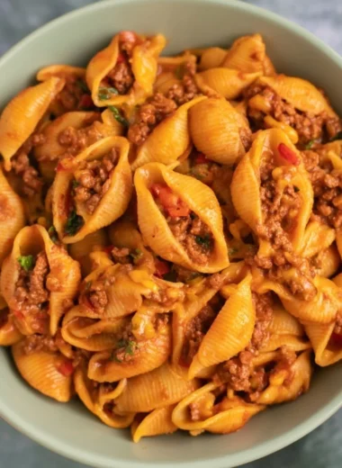 High protein taco pasta dish served in a bowl with fresh garnishes