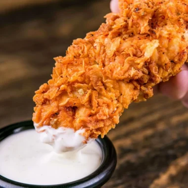 Plate of crispy homemade buttermilk chicken tenders ready to eat.