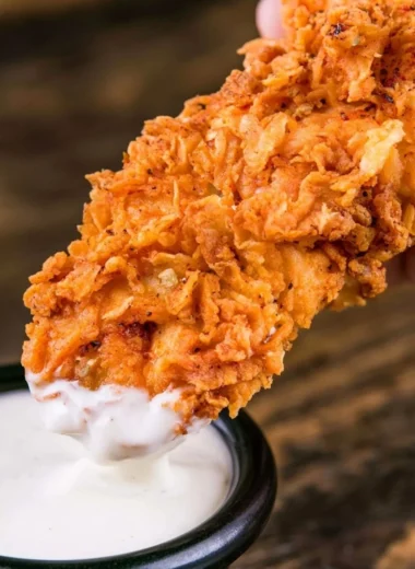 Plate of crispy homemade buttermilk chicken tenders ready to eat.