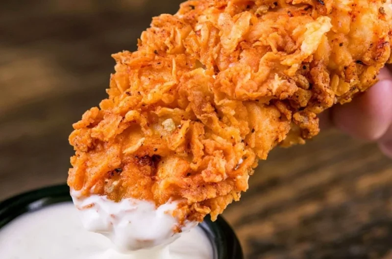 Plate of crispy homemade buttermilk chicken tenders ready to eat.