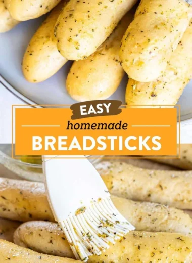 Plate of homemade garlic herb breadsticks with herbs and garlic butter