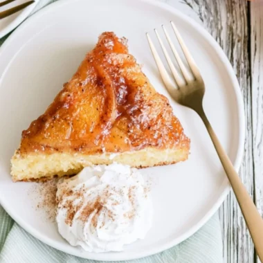 Delicious Peach Upside Down Cake topped with sliced peaches and caramel glaze.