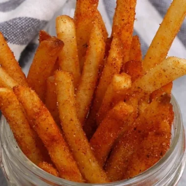 Crispy Popeyes Cajun Fries served in a red container