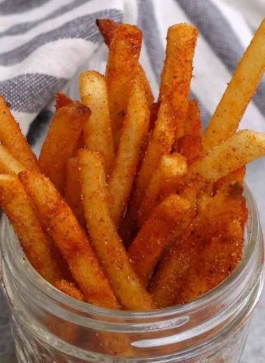 Crispy Popeyes Cajun Fries served in a red container