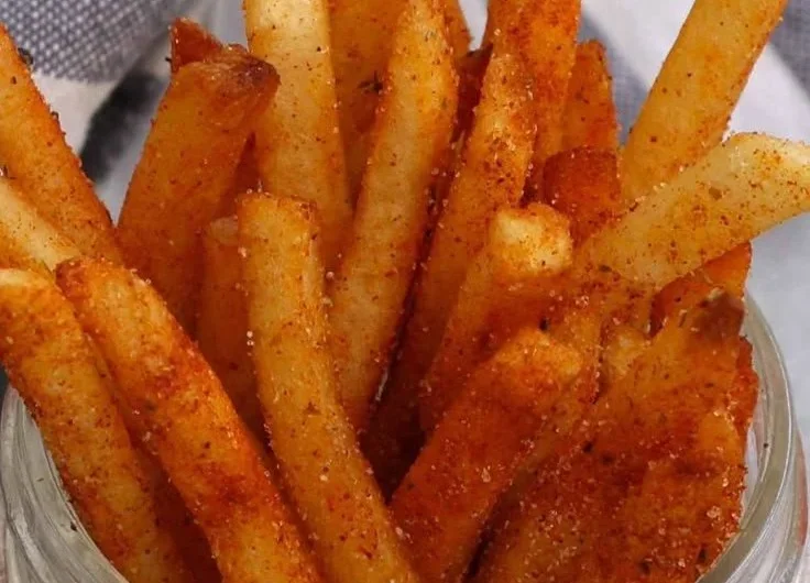 Crispy Popeyes Cajun Fries served in a red container