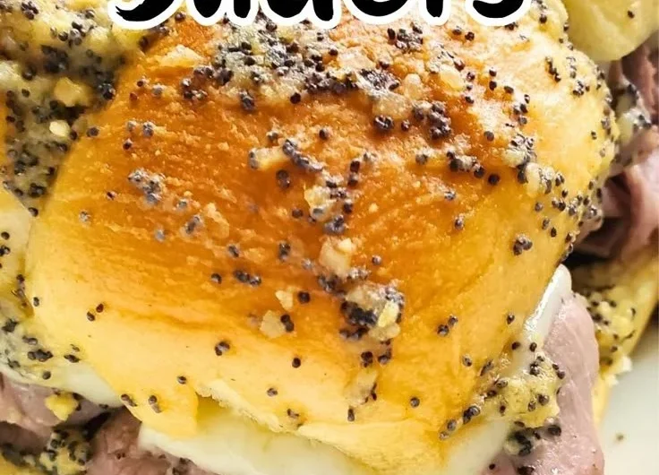 Plate of succulent roast beef sliders served with toppings