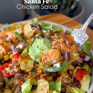 Colorful Santa Fe Salad with fresh vegetables, beans, and dressing.