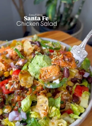 Colorful Santa Fe Salad with fresh vegetables, beans, and dressing.