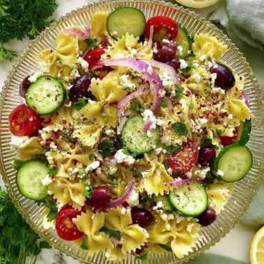 Delicious Tangy Mediterranean Pasta Salad with fresh vegetables and herbs