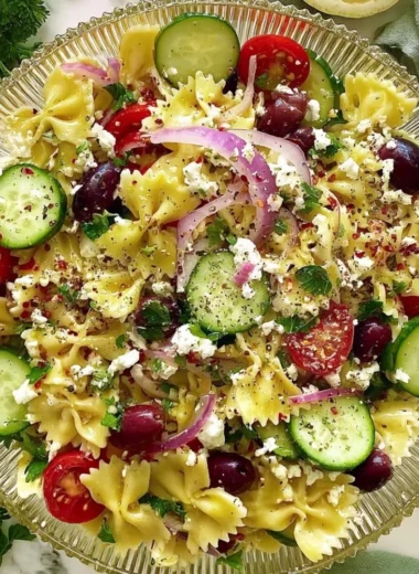 Delicious Tangy Mediterranean Pasta Salad with fresh vegetables and herbs