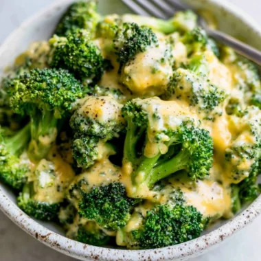 Delicious cheesy broccoli dish garnished and ready to serve
