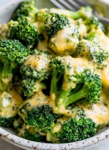 Delicious cheesy broccoli dish garnished and ready to serve