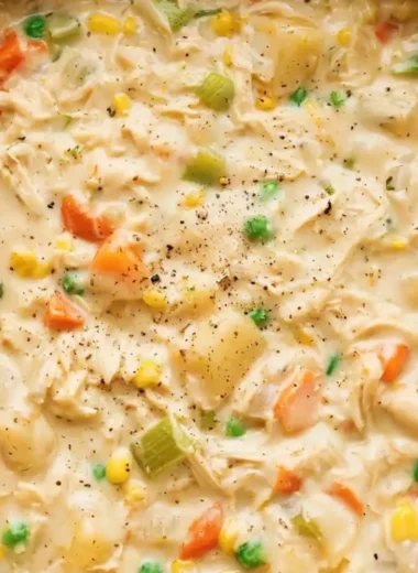 Delicious Chicken Pot Pie Soup served in a bowl with fresh herbs