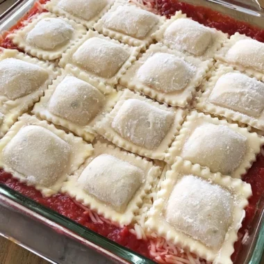 Cozy baked ravioli casserole with melted cheese and rich tomato sauce