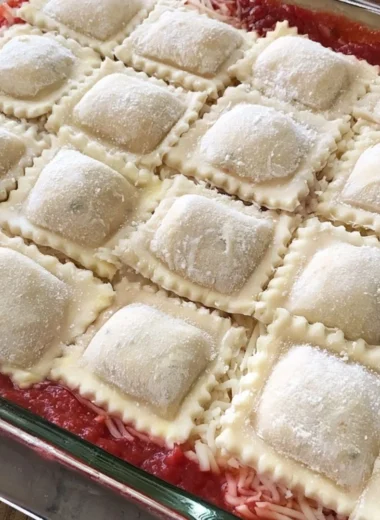 Cozy baked ravioli casserole with melted cheese and rich tomato sauce