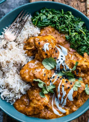 Cozy slow cooker chicken curry simmering with spices and vegetables in a pot.