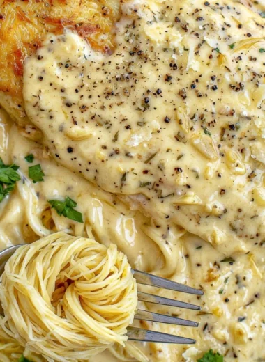 Delicious Crock Pot Angel Chicken served on a plate with herbs