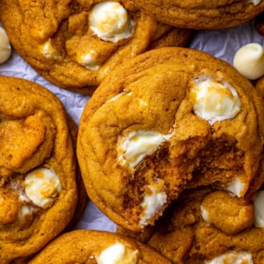 Delicious Pumpkin White Chocolate Chip Cookies on a wooden table.