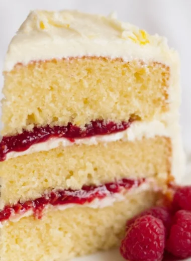 Raspberry Lemon Cake with fresh raspberries and lemon zest on top