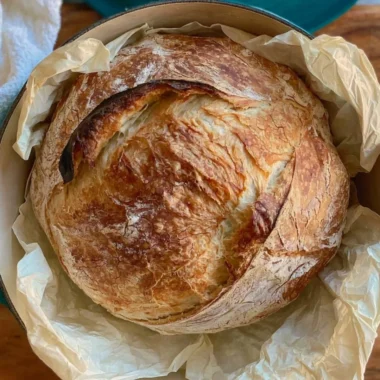 Homemade sourdough bread freshly baked on a wooden table