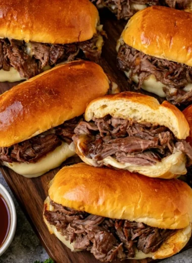 Cozy Crockpot French Dip Sandwiches with beef and melted cheese