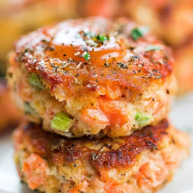 Crispy salmon cakes served with honey sriracha sauce on a plate